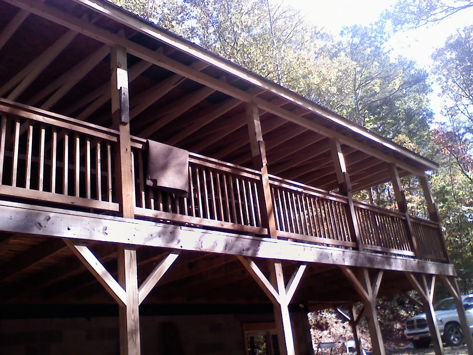 Timber framing under a new elevated porch and deck — Roof Leak Repair in Laingsburg by Roofing Brothers